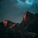 Low angle Photography of Rock Mountain Under Cloudy Sky  screen for extension Chrome web store in OffiDocs Chromium