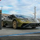 Luxury Olive Green Sports Car at a Gas Station  screen for extension Chrome web store in OffiDocs Chromium