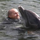Man and dolphin  screen for extension Chrome web store in OffiDocs Chromium