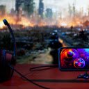 Mobile Game Controller and Headphones in Front of a Screen  screen for extension Chrome web store in OffiDocs Chromium