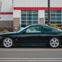 Modern black car parked on edge of road  screen for extension Chrome web store in OffiDocs Chromium