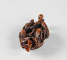 Free download Netsuke of Dragon Coiled around the Body of a Man free photo or picture to be edited with GIMP online image editor