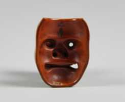 Free download Netsuke of Mask; Uzume (Okame) and a Tengu mask free photo or picture to be edited with GIMP online image editor