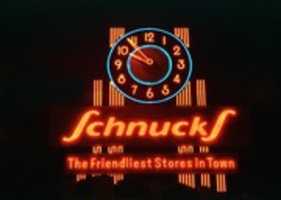 Free download Night view of the Schnucks Clock (1988)  free photo or picture to be edited with GIMP online image editor