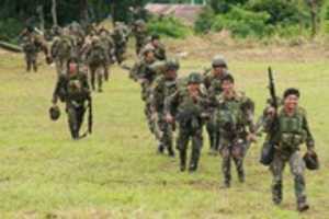 Free download Phillipine Soldiers Walking Across Field free photo or picture to be edited with GIMP online image editor