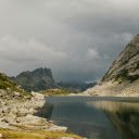 Picturesque vast lake surrounded with rocky mountains  screen for extension Chrome web store in OffiDocs Chromium