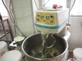 Free download Production of Wife-Cake in Factory, using automatic mixer to knead the dough free photo or picture to be edited with GIMP online image editor