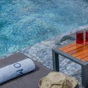 Red Drinks on a Poolside Table  screen for extension Chrome web store in OffiDocs Chromium