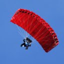 Red parachute in the blue sky.  screen for extension Chrome web store in OffiDocs Chromium
