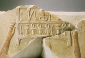Free download Relief of men carrying chests of linen free photo or picture to be edited with GIMP online image editor