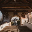 Rustic Archway with Wooden Beams in Tranquil Setting  screen for extension Chrome web store in OffiDocs Chromium