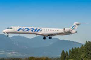 Bezpłatne pobieranie S5-AAN / Adria Airways / Bombardier CRJ 900 / Ljubljana Airport (LJLJ) darmowe zdjęcie lub obraz do edycji za pomocą internetowego edytora obrazów GIMP