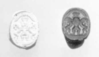 Free picture Scarab seal with Bes dominating two lions below a winged sun disc to be edited by GIMP online free image editor by OffiDocs