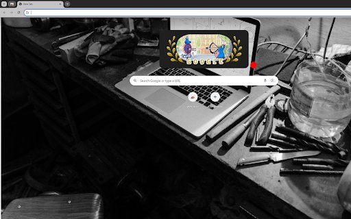 A Grayscale Photo of a Laptop on a Work Table  from Chrome web store to be run with OffiDocs Chromium online