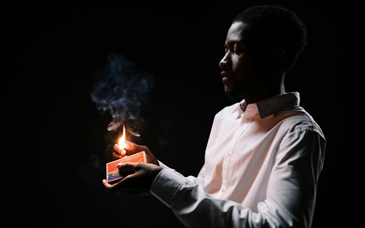 A Man Holding a Burning Match Stick  from Chrome web store to be run with OffiDocs Chromium online