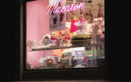 A pink neon sign in a window with a pink light  from Chrome web store to be run with OffiDocs Chromium online