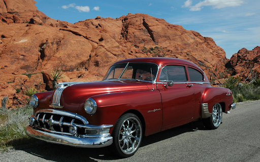 A Red Vintage Car Parked on the Road  from Chrome web store to be run with OffiDocs Chromium online