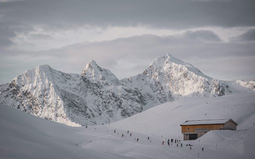 A snowy mountain with a cabin in the middle  from Chrome web store to be run with OffiDocs Chromium online