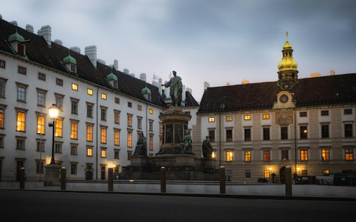 A statue is in front of a building at dusk  from Chrome web store to be run with OffiDocs Chromium online