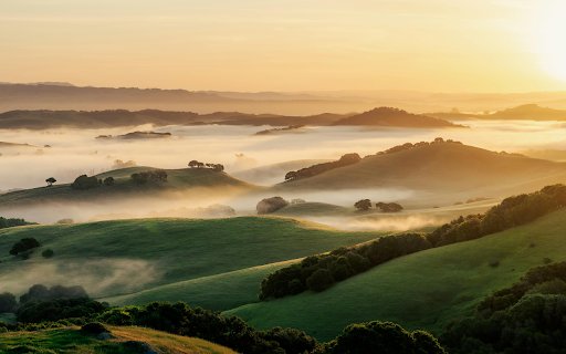 A sunrise over a valley with fog and hills  from Chrome web store to be run with OffiDocs Chromium online