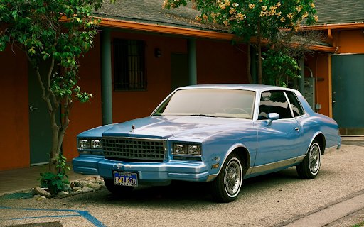 Blue Car Parked by a House  from Chrome web store to be run with OffiDocs Chromium online