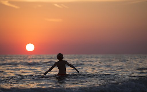 Boy bathing in the sea  from Chrome web store to be run with OffiDocs Chromium online