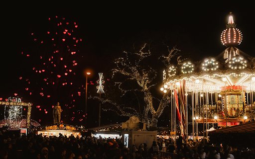 Festive Night at a Christmas Market with Illuminated Carousel  from Chrome web store to be run with OffiDocs Chromium online