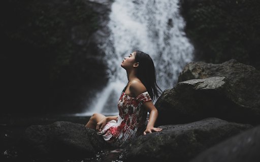 Girl sitting by the waterfall  from Chrome web store to be run with OffiDocs Chromium online
