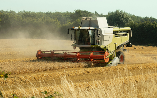 Green and Red Tractor on Farm Field  from Chrome web store to be run with OffiDocs Chromium online