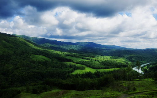 Green Valley Under a Cloudy Sky  from Chrome web store to be run with OffiDocs Chromium online