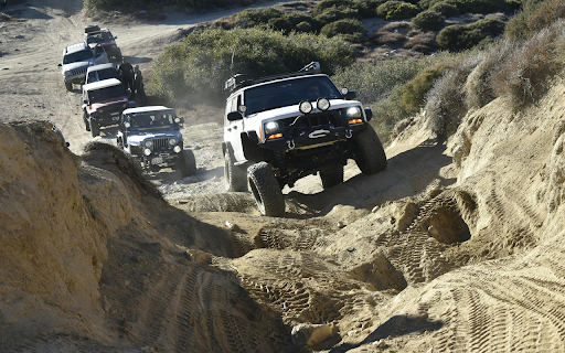 Jeeps Riding on a Sandy Terrain  from Chrome web store to be run with OffiDocs Chromium online