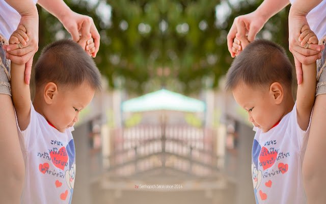 Little boy holding his mothers hand.  from Chrome web store to be run with OffiDocs Chromium online