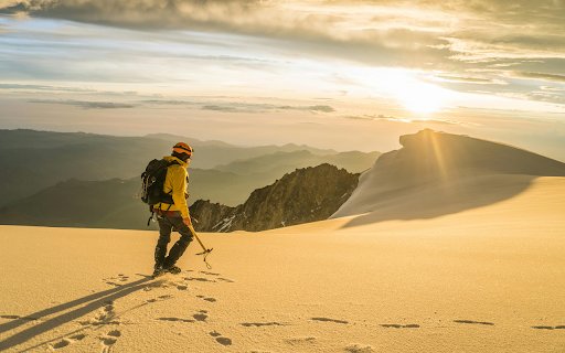 Man Hiking in Mountains at Sunset  from Chrome web store to be run with OffiDocs Chromium online