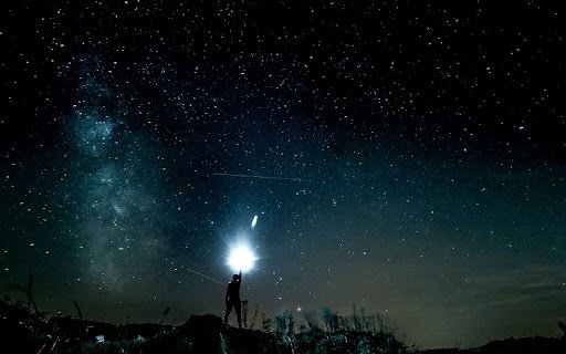 Person Under a Star Filled Night Sky  from Chrome web store to be run with OffiDocs Chromium online