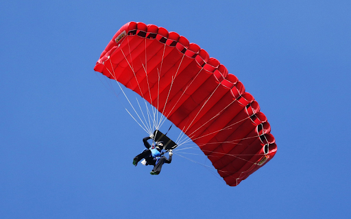 Red parachute in the blue sky.  from Chrome web store to be run with OffiDocs Chromium online