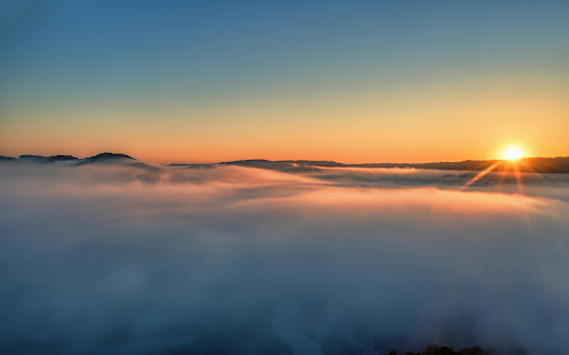 Serene Sunrise Above Foggy Wisconsin Hills  from Chrome web store to be run with OffiDocs Chromium online