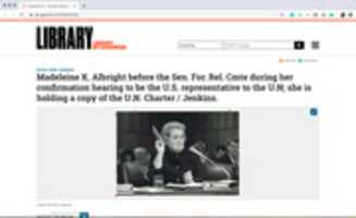 Free download Screenshot of Madeleine K. Albright before the Sen. For. Rel. Cmte during her confirmation hearing to be the U.S. representative to the U.N; she is holding a copy of the U.N. Charter / Jenkins. free photo or picture to be edited with GIMP online image editor