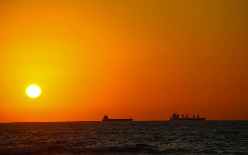 Silhouettes of Ships at Sea During Sunset  from Chrome web store to be run with OffiDocs Chromium online