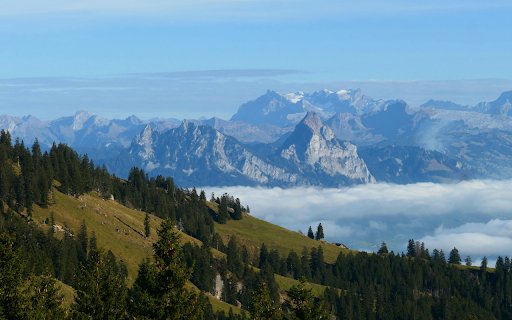 Stunning View of Swiss Alps with Foggy Landscape  from Chrome web store to be run with OffiDocs Chromium online