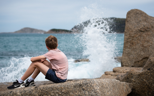 The boy looked at the sea  from Chrome web store to be run with OffiDocs Chromium online