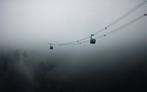 Two cable cars are suspended in the fog  from Chrome web store to be run with OffiDocs Chromium online