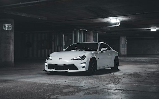 White Toyota Sports Car Parked in an Underground Parking Lot  from Chrome web store to be run with OffiDocs Chromium online
