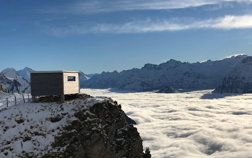 Wooden Shed over Cloud under Mountains Peaks  from Chrome web store to be run with OffiDocs Chromium online