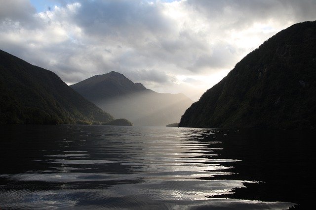 Free download sea mountains new zealand sun rays free picture to be edited with GIMP free online image editor