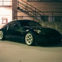 Shiny Car Parked Beside a Brick Building  screen for extension Chrome web store in OffiDocs Chromium