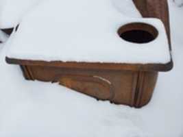 Free download Snow on vintage wood stove free photo or picture to be edited with GIMP online image editor