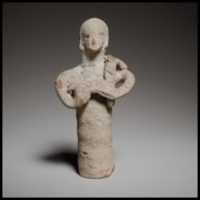 Free download Standing figurine holding a quadruped free photo or picture to be edited with GIMP online image editor