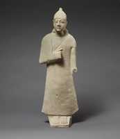 Free download Statuette of a beardless male votary wearing a long garment and a conical helmet free photo or picture to be edited with GIMP online image editor