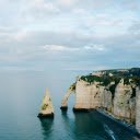 Stony cliffs covered with greenery near ocean  screen for extension Chrome web store in OffiDocs Chromium
