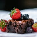 Strawberry on Chocolate Cake on White Ceramic Plate  screen for extension Chrome web store in OffiDocs Chromium
